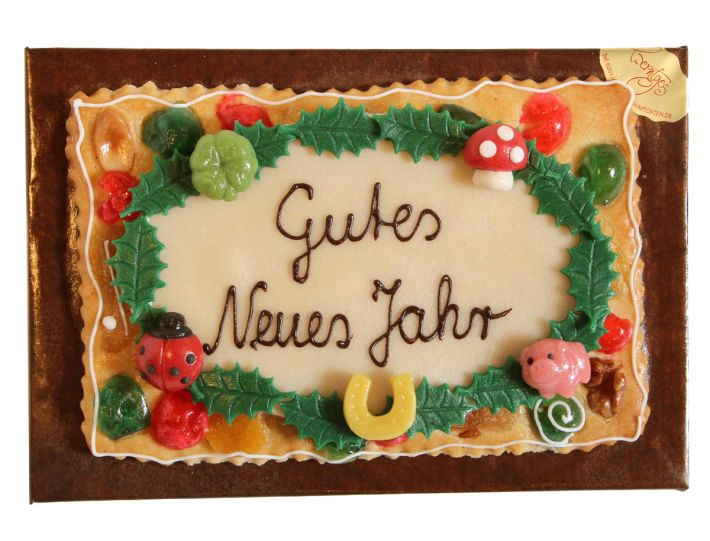 Gebäckplatte mit Textoval und Glückssymbolen