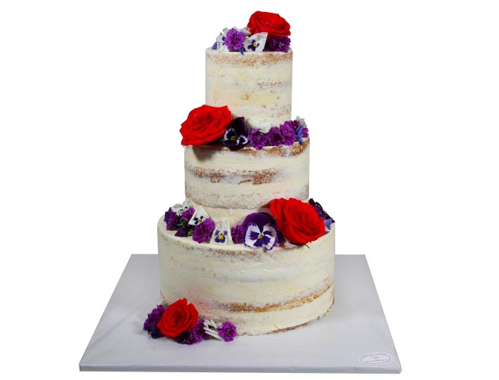 Naked Cake mit roten Rosen und konzentriertem Blütenmix