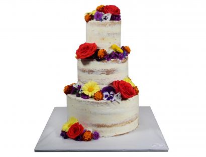 Naked Cake mit buntem Blütenmix und roten Rosen